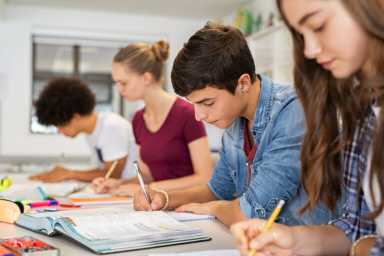 Teenagers working together in class during Secondary Plus English programme at a Residential English Camp.